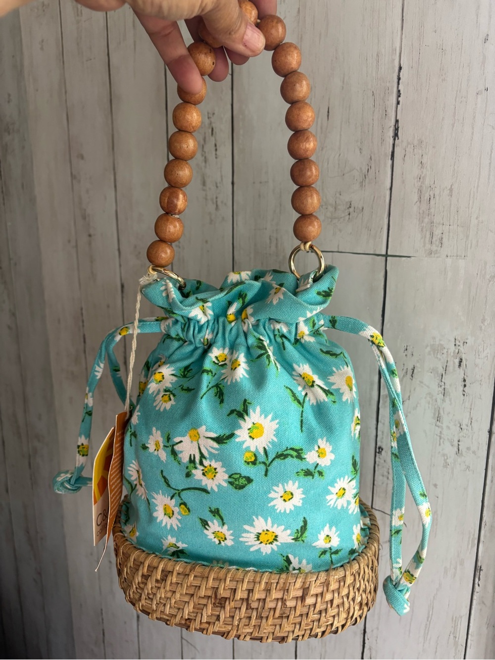 Teal C&C California daisy floral drawstring basket handbag.